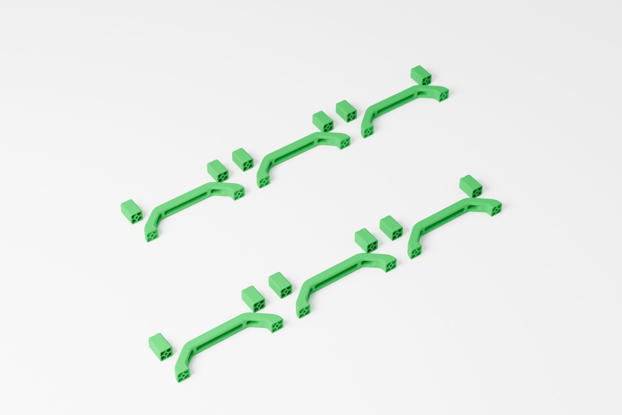 Wizualizacja z modelu CAD (Blender). Seria zestawów: rączka z dwiema podkładkami, druk proszkowy barwiony na zielono.