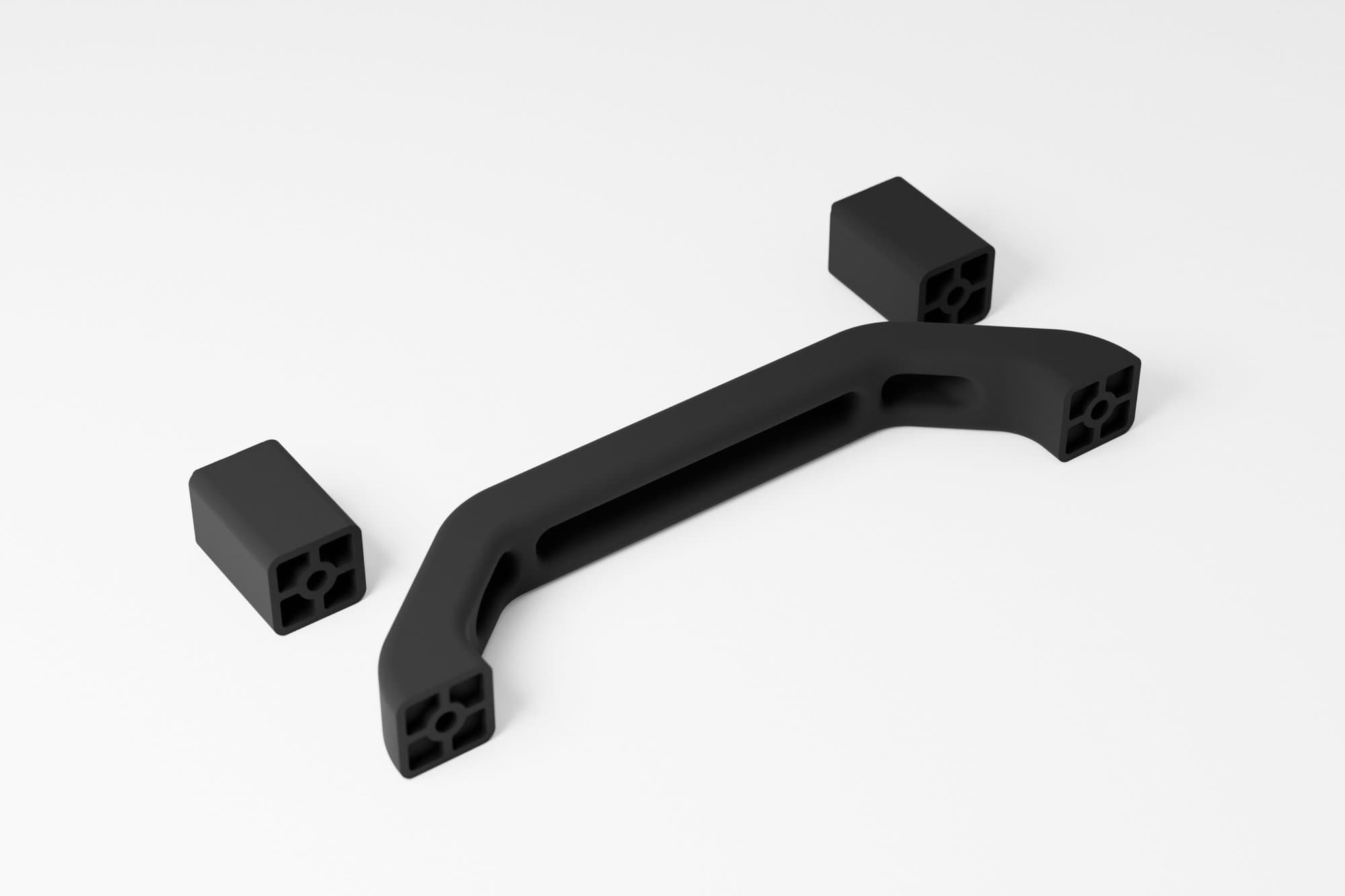 Wizualizacja z modelu CAD (Blender). Rączka z dwiema podkładkami 40 mm, wariant do druku MJF w czarnym PA12.