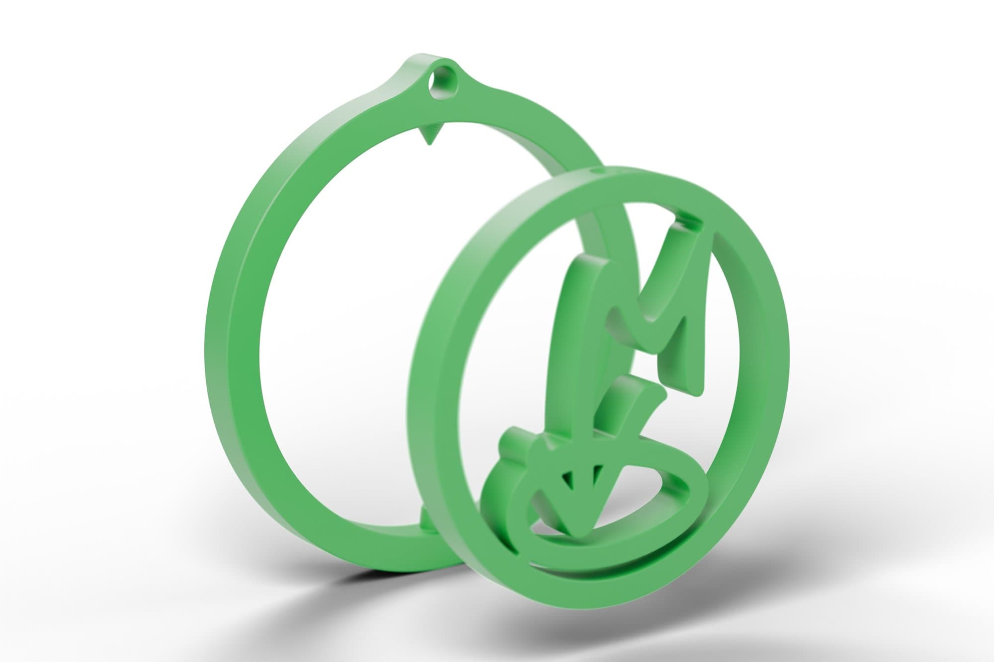 Render from the CAD model (Blender). Exploded view: the ring with its eye and pins, and the ⌀36.4 mm logo disc. They print together, assembled.